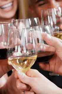 Guests cheers with a mix of red and white wine glasses