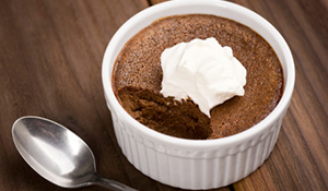 Chocolate Pot De Creme next to a spoon with one bit taken